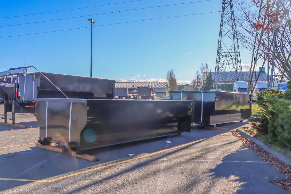 Roll-off dumpster ready for waste disposal at job site for 2 Yard Dumpster Rental in Fowler